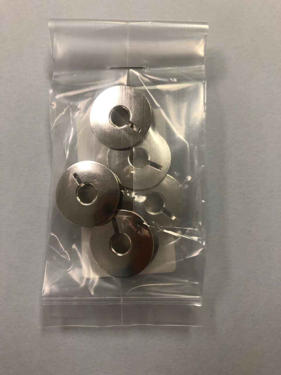 Aluminum L bobbins for quilting machines
